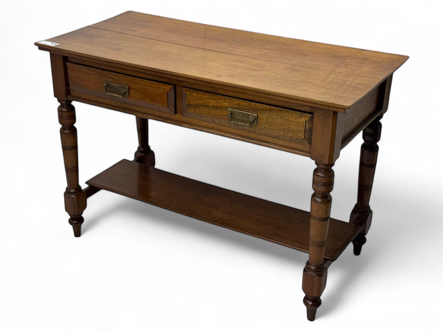 Victorian mahogany side table fitted with two drawers,  rectangular top over two short drawers with moulded facias and brass drop handles, turned front and rear supports joined by an open undertier, on turned feet 