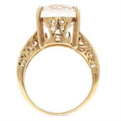 9ct gold kunzite ring, four claw set with a single oval cut kunzite, pierced design gallery and shoulders