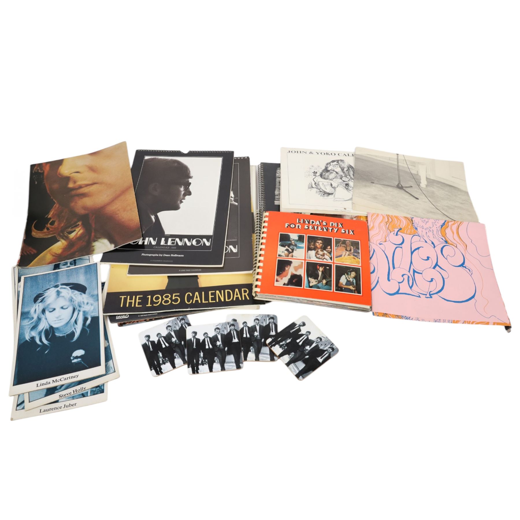 Beatles memorabilia, comprising four Linda McCartney photograph diaries from 1976-1979, three posters, four coasters, 1970 John & Yoko calendar, 1980s and 1990s Beatles and John Lennon calendars