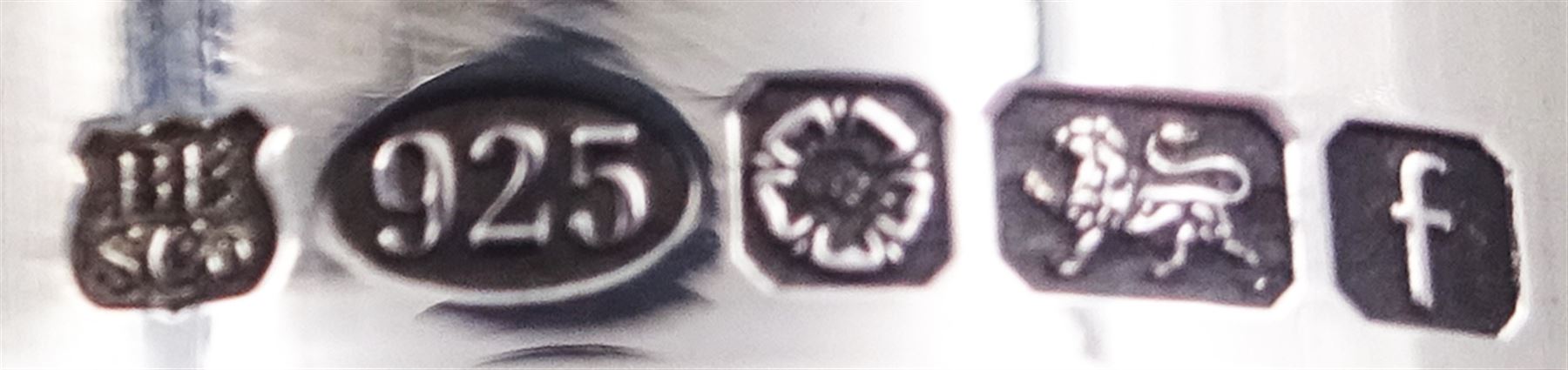 Two small modern silver mounted cut glass decanters, the first example of squat bulbous form, the body with navette, octagonal and hobnail cut decoration, with conforming stopper, the silver collar hallmarked Barker Ellis Silver Co, Sheffield 2005, H19cm, the second example, a ships decanter, with hobnail cut star decoration and conforming stopper, the silver collar hallmarked C J Vander Ltd, Sheffield 2005, H19cm, with boxes