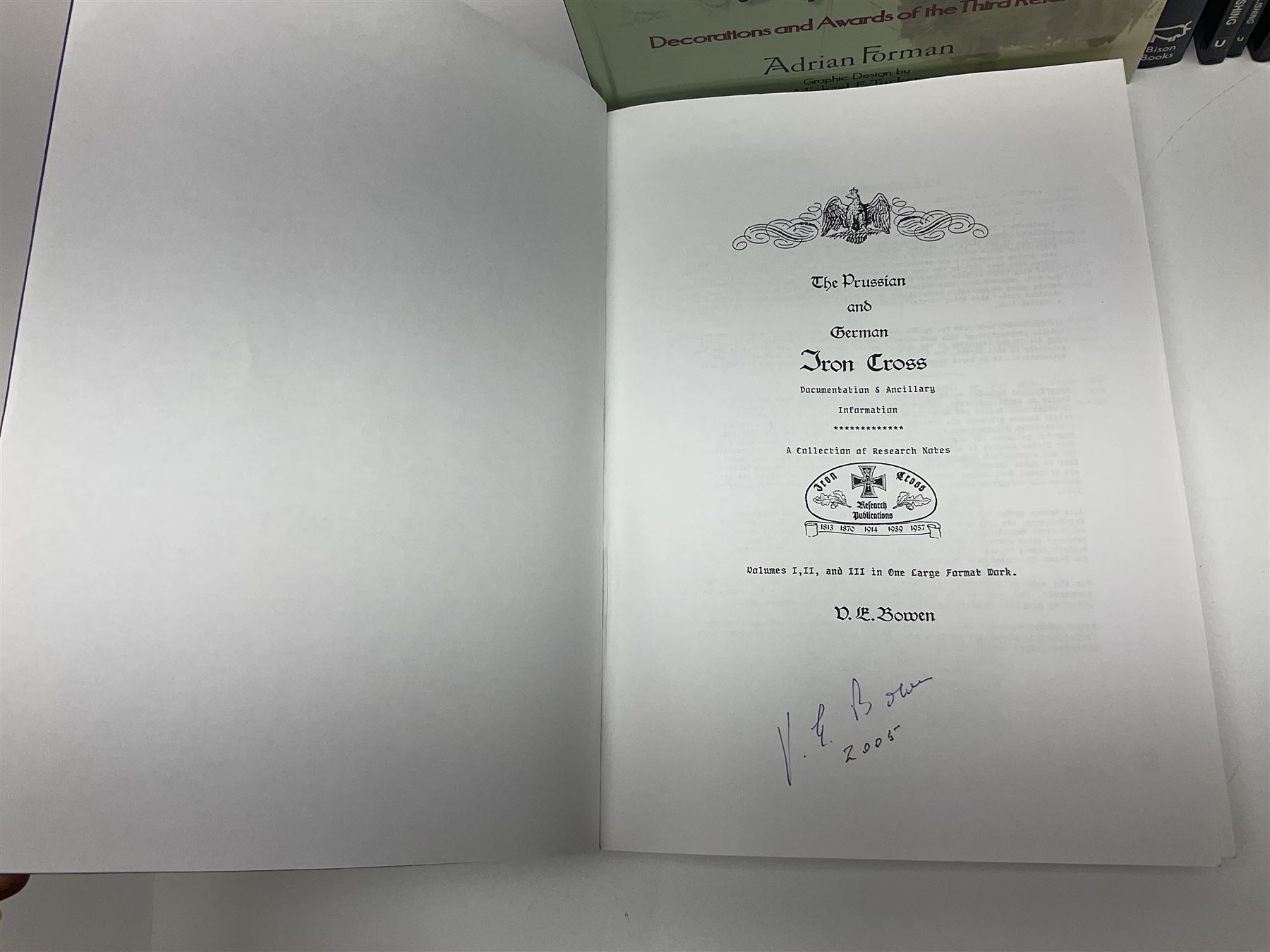 Excellent collection of twelve German Third Reich reference books including four by Adrian Forman - Guide to Third Reich German Awards and Documents, ........ Documents and Their Values. Volumes one and two. Both limited edition and signed by the author; and Bravery, Courage & Valour - Decorations and Awards of the Third Reich; D.E. Bowen: The Prussian & German iron Cross. Signed by the author; Ulric of England: Collecting Third Reich 'SS' and Political Cuffbands. Two volumes; Don Boyle: 'SS' Totenkopf H. Himmler Ring 1933-1945. 2nd printing. Signed by the author and inscribed to 'Adrian' (Forman); and four others (12)