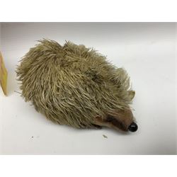 Group of Steiff figures, comprising Mikki and Mukki, circa 1950s no 7628/12 and 7627/12, with original tags, two hedgehogs no 1570/10, and another smaller 1670/03, small owl no 7480/06, and painted metal Steiff harlequin style bear