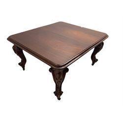 Victorian mahogany extending dining table, moulded rectangular top with rounded corners, telescopic mechanism with leaf and winding handle, on leaf and cartouche carved cabriole supports, brass and ceramic castors