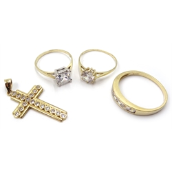 Three 9ct gold stone set dress rings and a similar cross pendant