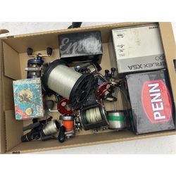 Quantity of fishing reels to include Aerlex XSA, Tronixpro Envoy, both in boxes, Ambassador 9000 and 6500, Leeda Riptide, Penn Affinity 7000, Carptek, together with a quantity of fishing tackle and accessories and two folding fishing chairs
