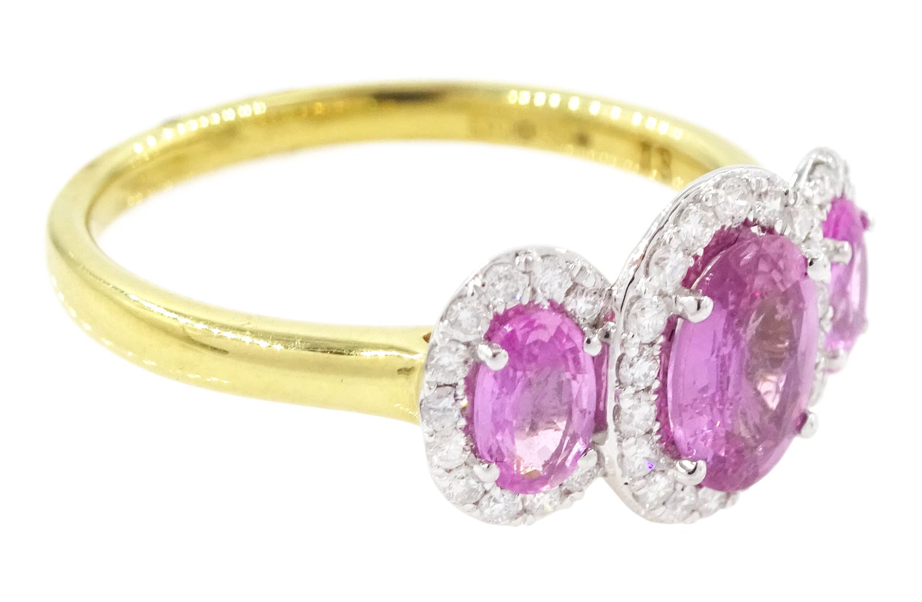 18ct gold pink sapphire and diamond trilogy ring, three oval cut sapphires surrounded by round brilliant cut diamonds, hallmarked, total sapphire weight approx 1.45 carat, total diamond weight approx 0.25 carat