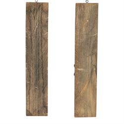Pair of 17th century carved oak terms, each depicting a male figure in headpiece, with fish tail beneath fruits, 51.5cm