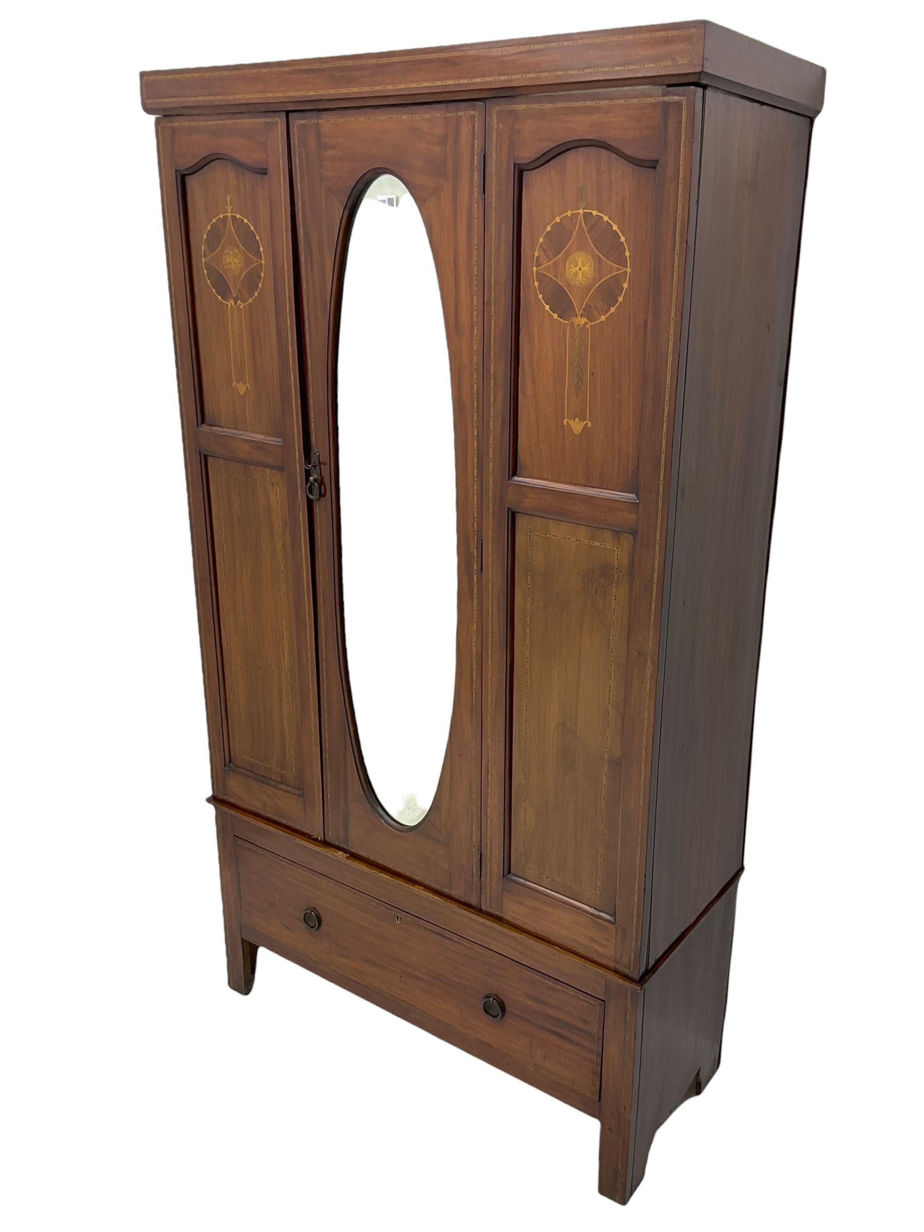 Edwardian inlaid mahogany wardrobe, oval mirror door, single drawer to base