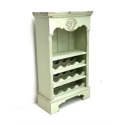 Painted pine twelve bottle wine rack with additional single shelf,, reeded moulding, shaped apron, shaped bracket supports 
