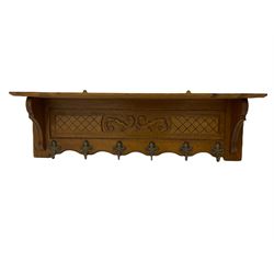 French style oak coat rack, carved with scrolled foliage and fitted with hooks