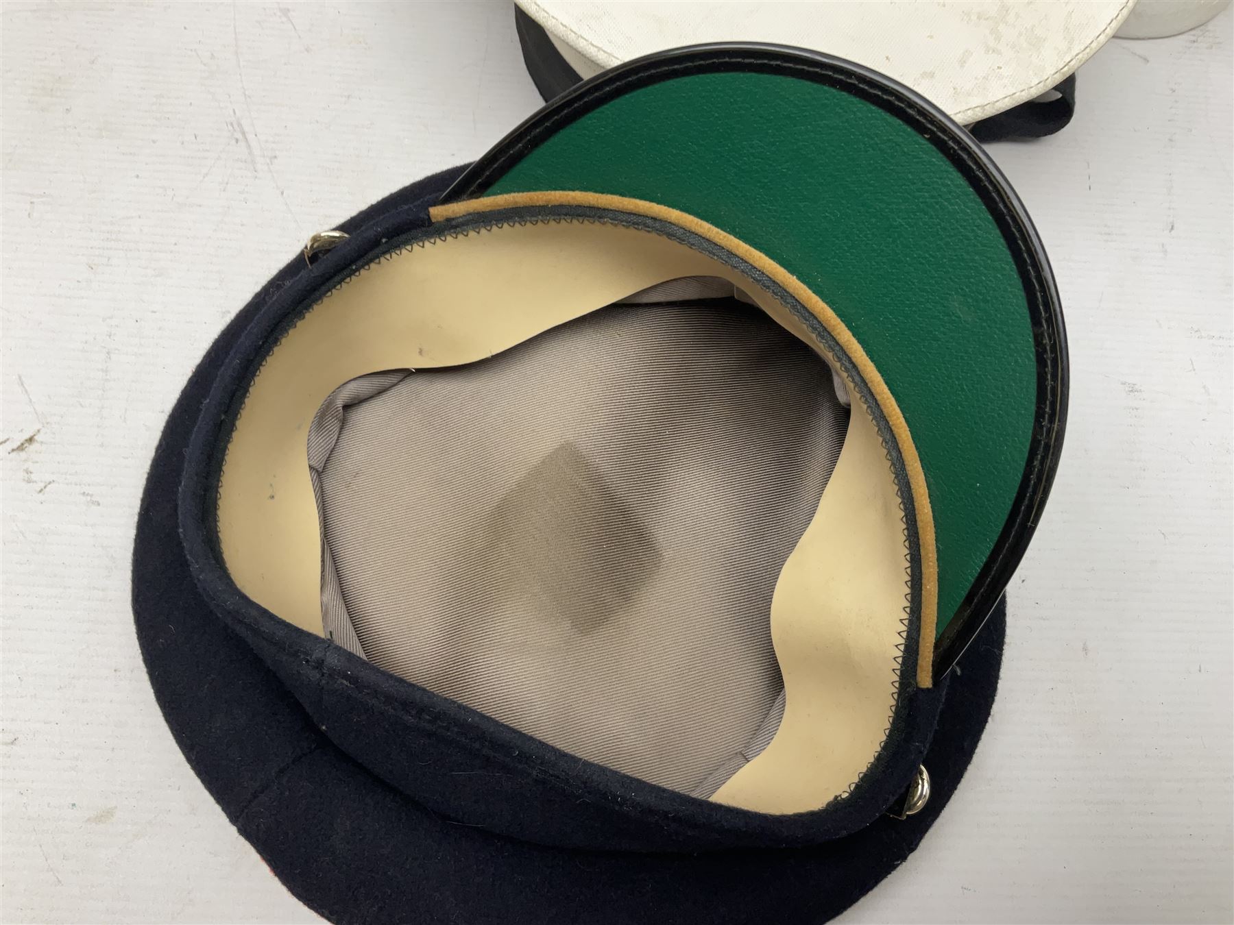 Five military caps/berets comprising two peaked caps with 'Yorkshire' and 'Royal Engineers' badges; maroon beret with parachute regiment badge; red beret with Military Police badge; and AB seaman hat with HM Submarines band; and a felt and webbing covered water bottle (6)