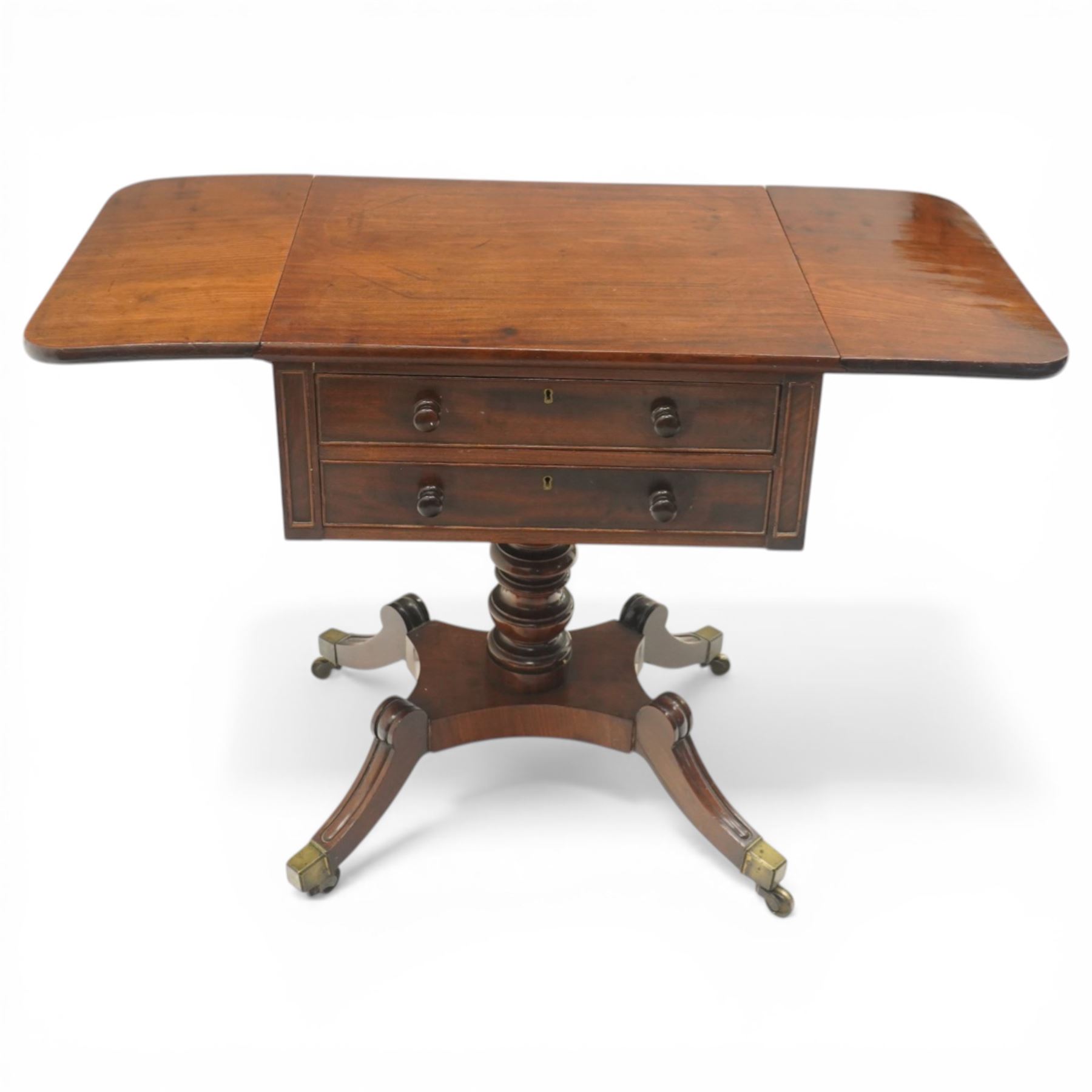 Georgian style mahogany drop leaf work table, rectangular top with rounded drop leaves over two frieze drawers with turned handles, raised on turned pedestal support with four outswept legs terminating in brass caps and castors