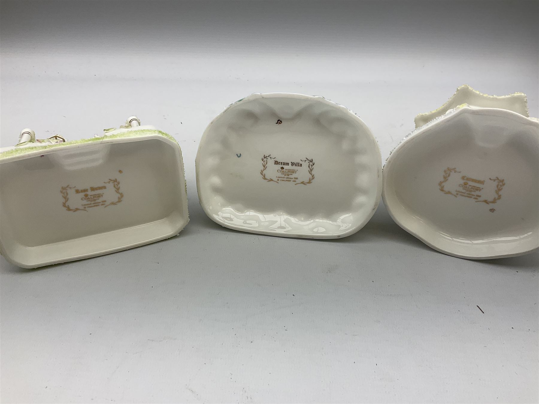 Twelve Coalport bone china pastille burner cottages, to include Fortune Towers, Summer Palace, The Vinery, Springtime Cottage, Dream Villa, Half Moon House, etc, all with original boxes and some with certificates 