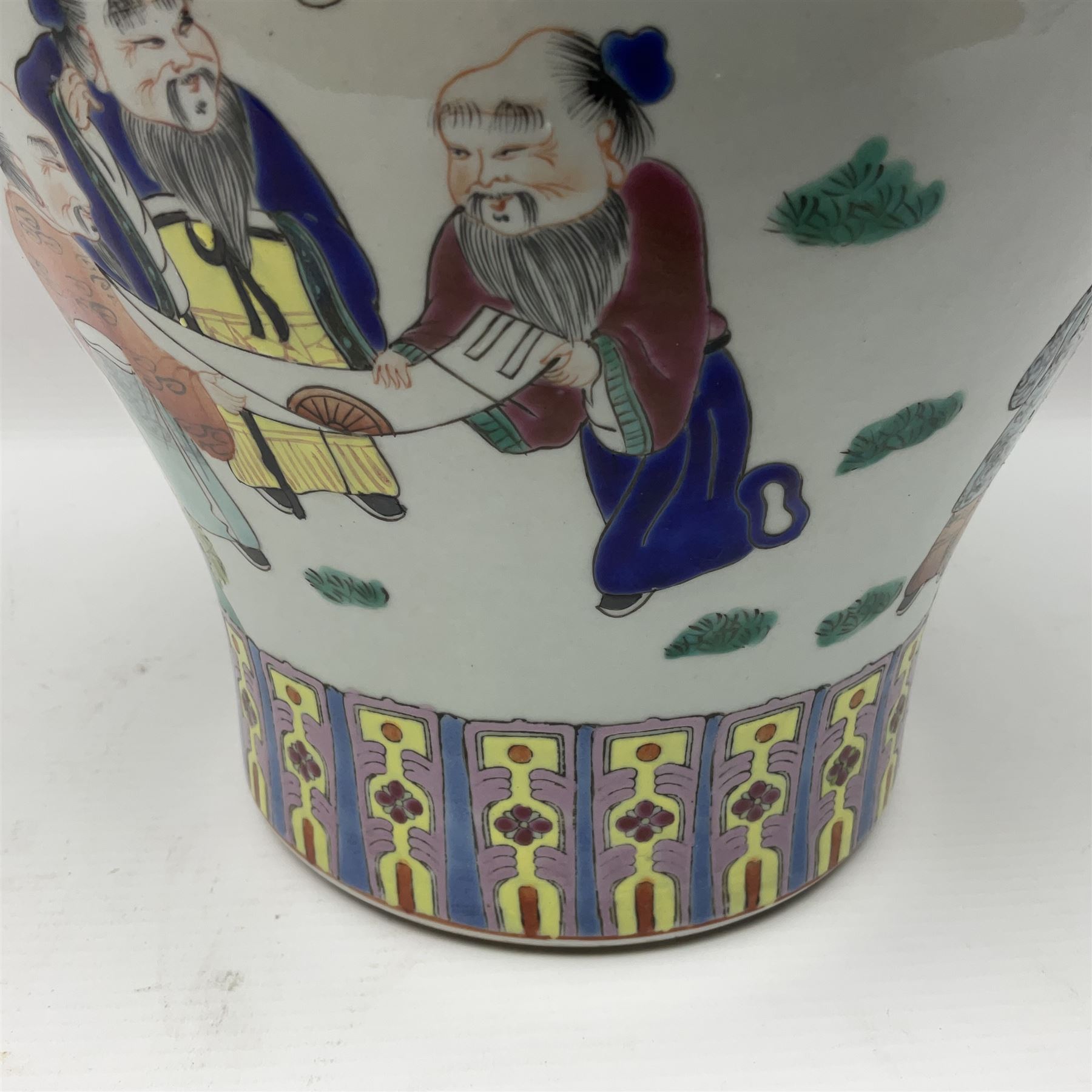 20th century Chinese Famille Rose vase, of baluster form with flared lobed rim and twin figural handles, decorated in polychrome enamel with figures dancing and playing instruments within a garden setting, H42cm