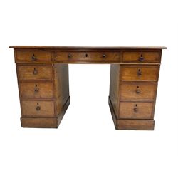 Victorian mahogany twin pedestal desk, rectangular top with moulded edge and inset leather writing surface, fitted with central drawer flanked by four graduating drawers with cock-beaded facias