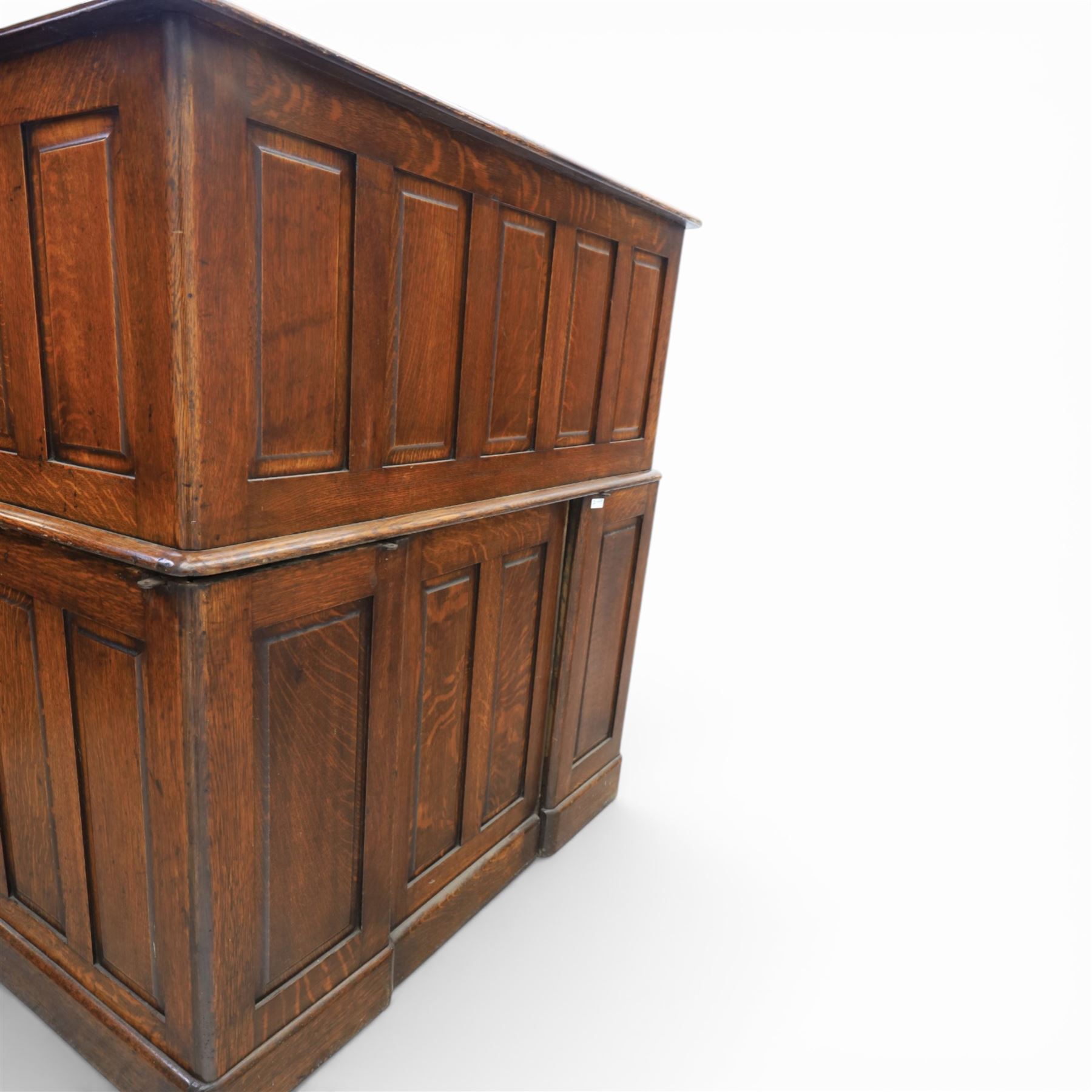 Globe Wernicke - Oak roll top desk, tambour roll top enclosing a fitted interior, raised on two pedestal bases with fitted drawers, raised on a plinth base 