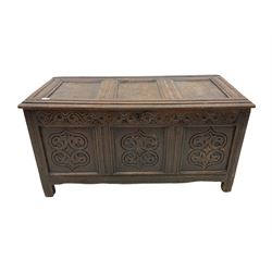 18th century oak blanket chest, triple panelled lid over triple panel front, the front carved with stylised foliate motifs, moulded frame and stile supports, the interior fitted with candle box