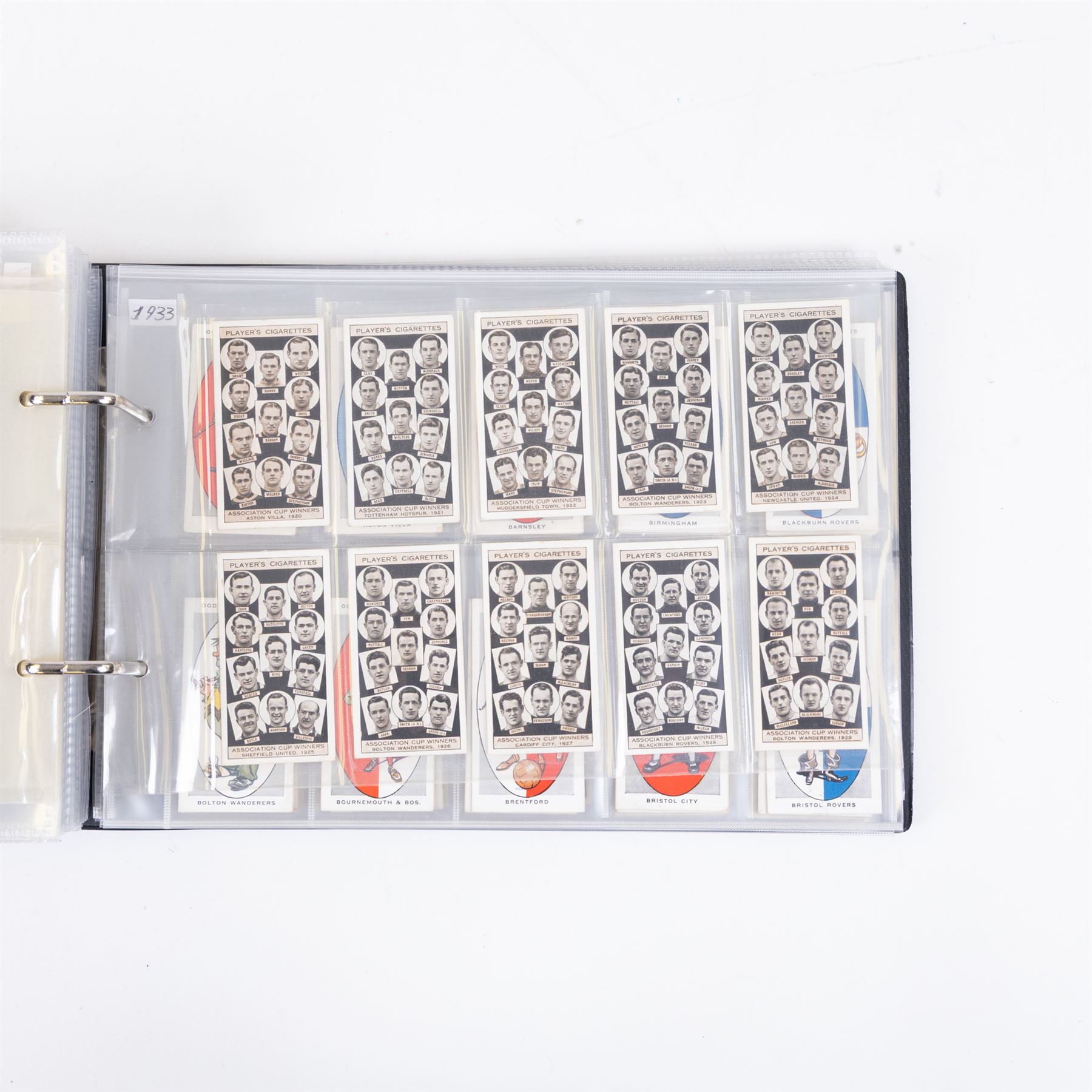 Collection of Edwardian and later Football related trading and cigarette cards, including forty-nine of fifty 1906 Ogden's Football Club Colours, 1922 PALS Footall series, ninety of one hundred 1925 Gallaher Famous Footballers, complete set of forty-four 1926 Ogden's Captains of Association Football Clubs and Colours, complete set of fifty 1927 Players Football Caricatures by MAC,  complete set of fifty 1927 Players Football Caricatures by RIP,  complete set of fifty 1930 Players Association Cup Winners, complete set of 50 1933 Ogdens AFC Nicknames etc, housed in brown cigarette card album