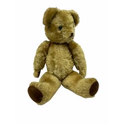 Large mid-20th century English plush covered teddy bear, the revolving head with applied eyes, vertically stitched nose and mouth and jointed limbs H64cm; another long-haired teddy bear with wood wool filling; a smaller part wood wool filled teddy bear with blue eyes; and a small black teddy bear (4)