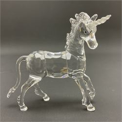 Swarovski Crystal animals, comprising white peacock, the tail with cascading blue flowers, perched eagle with yellow beak, ibex with frosted crystal horns and unicorn with frosted crystal horn, tallest H13cm