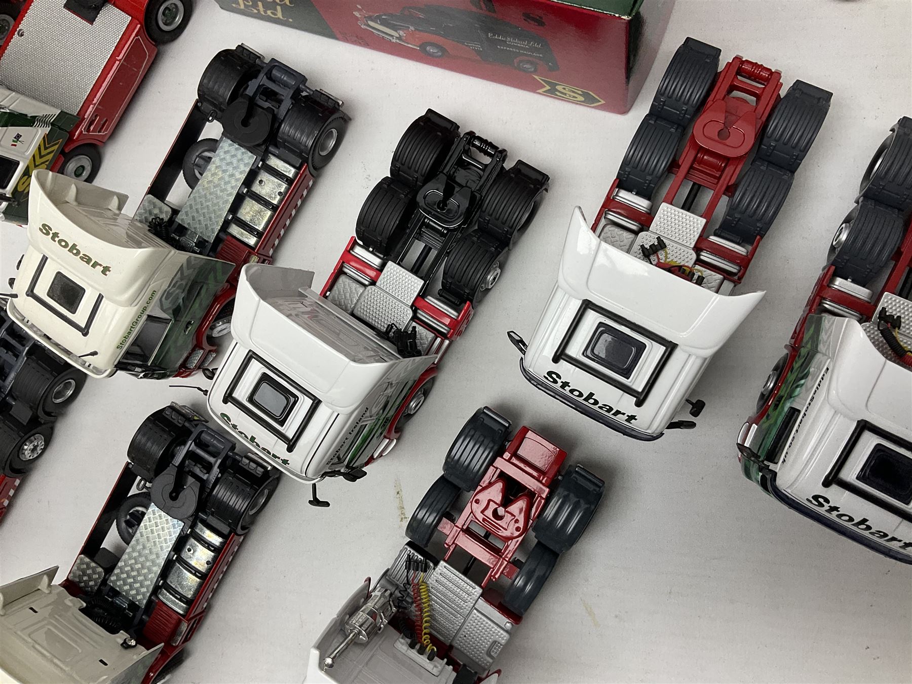 Eddie Stobart - three Oxford Die-Cast Super Rugby League lorries in perspex display cases including the two Hull Clubs; two Lledo Vanguard vans; two Days Gone vans; and Saico Truck & Trailer; all boxed; together with fourteen unboxed Corgi and other tractor/cab units etc (23)