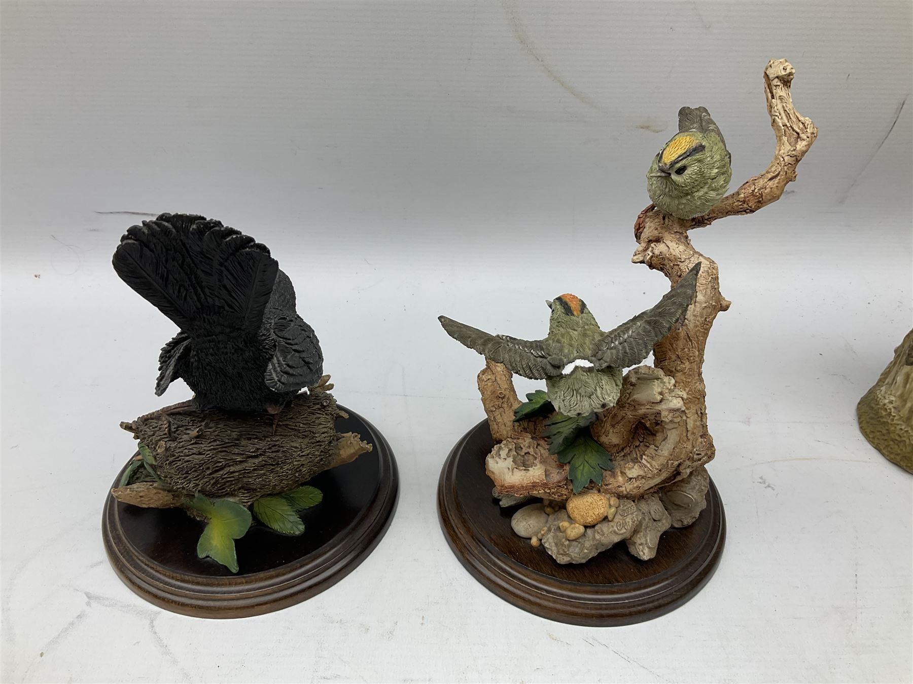 Three Country Artist figure groups, comprising 'Woodland Visitors', 'Bluetit on Tap' and 'Blackbird', together with two other animal figure groups
