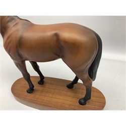 Beswick 'Mill Reef' horse figure, on a wooden plinth together with Beswick Ware horse figure 'Red Rum' on wood plinth, both with printed mark beneath