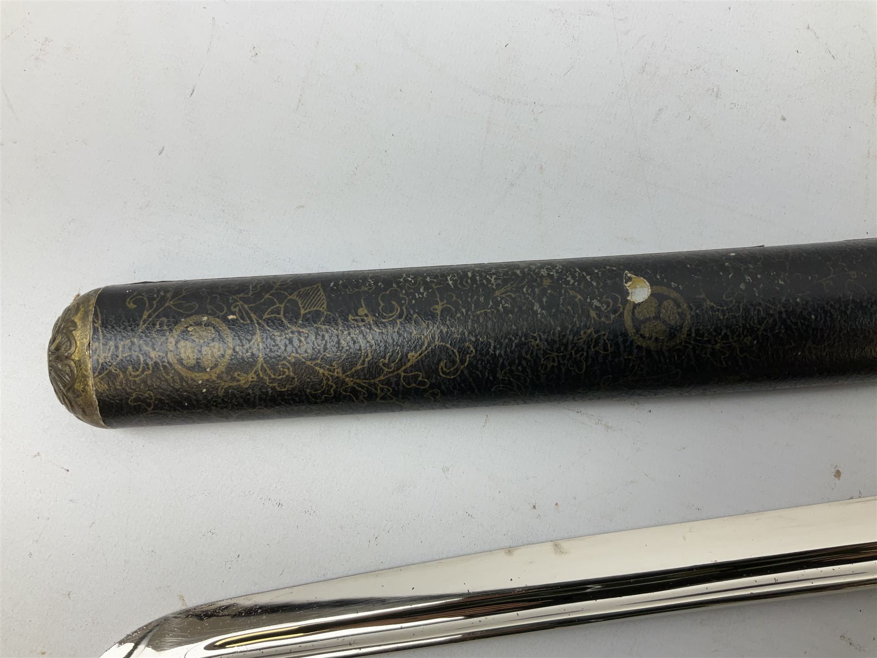 Three reproduction swords - Japanese katana and saya; Tai Chi sword with ornate scabbard; and dress sword with fullered triangular blade and horn handle (3)