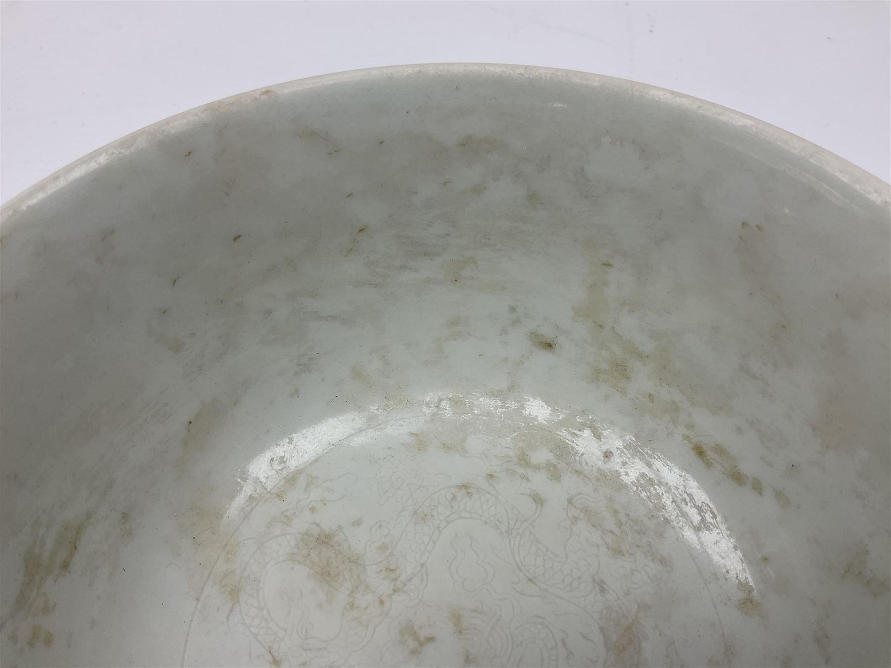 Pair of Chinese famille jaune bowls, decorated in green enamel with a dragon chasing a flaming pearl amongst clouds, upon a yellow ground, the interior decorated to centre with dragon, with six character mark beneath, D17.5cm