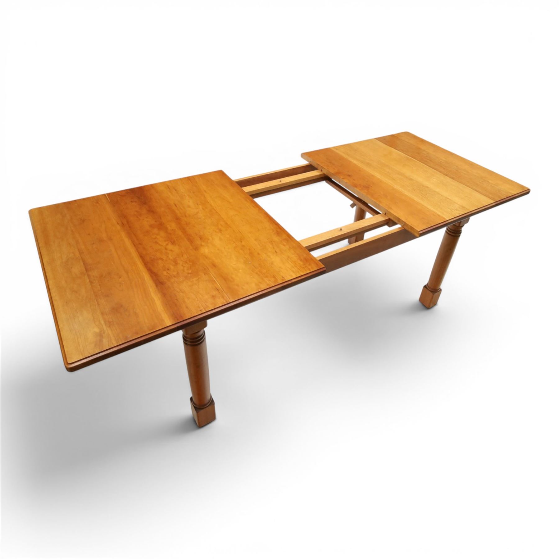 Knightman - cherrywood extending dining table, the rectangular top raised on four turned legs, with additional leaf extending to 230cm total, recessed carved knight trademark, by Horace Knight of Old Mill Furniture, Balk near Thirsk