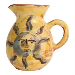 Vallauris French pottery by Patrick Bocca Rossa, jug painted with sun motifs upon a yellow ground, and an octagonal plate with a face to the center, both signed, jug H22cm 
