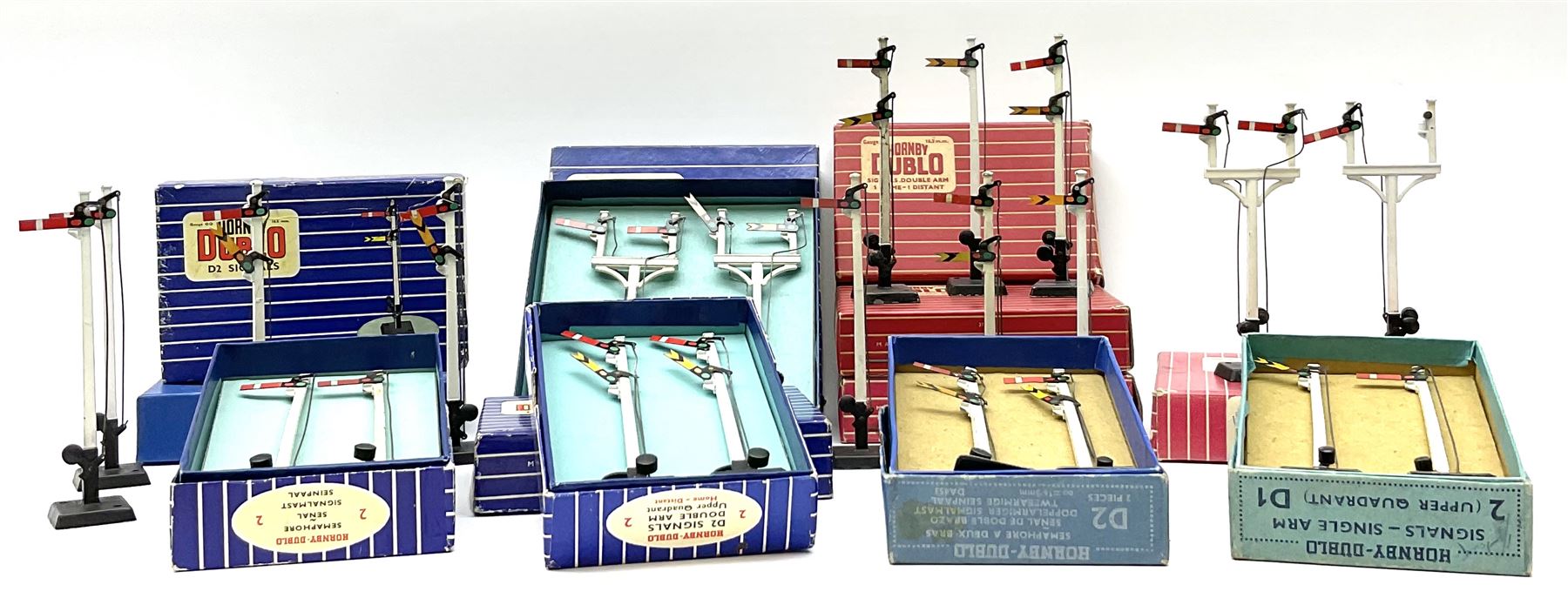 Hornby Dublo - twelve manually operated semaphore signals comprising one 5050 Signals Single Arm (D1) 2 Home, one 5060 Junction Signals (D3) 2 Home; D3 Junction Signal Upper Quadrant (1 Home 1 Distant); two 5055 Signals Double Arm (D2) 1 Home 1 Distant; two D2 Signals Double Arm (Upper Quadrant); three D2 Signals Double Arm Upper Quadrant Home - Distant; and two D1 Signals Single Arm Upper Quadrant; all boxed (12)