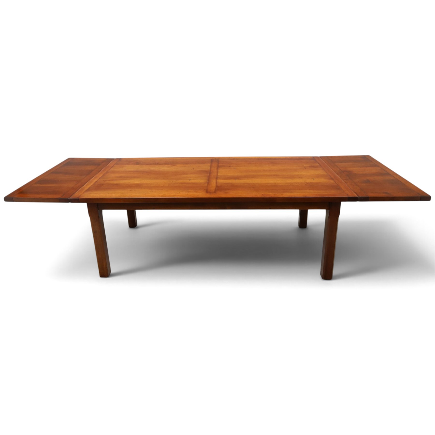 French cherry wood extending dining table, rectangular top on square chamfered supports with two additional leaves; with Batheaston - set of eight cherry wood waived ladder back dining chairs with rush seats (W46cm H98cm)