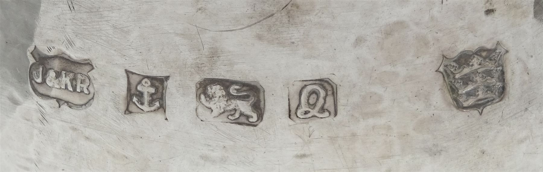 Modern Guild of Hull Silversmiths silver spot hammered bowl of spherical form, hallmarked J & K R, Birmingham 1990, also marked with the three crowns mark of the Guild of Hull Silversmiths, H 7.5cm, approximate weight 4.32 ozt (134.6 grams)

Abraham Barachin was the last Hull silversmith to use the Hull mark of three ducal coronets in around 1706. 
However in 1983 the Assay Offices of Great Britain and the City of Kingston upon Hull granted the Guild of Hull Silversmiths permission to use the City's Coat of Arms as an additional mark on pieces they produced. 