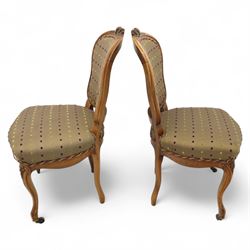 Set of four Victorian walnut framed salon chairs, upholstered in olive fabric with diamond embossed tufts