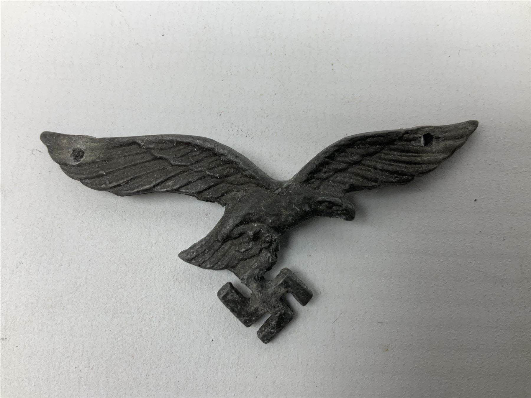 Five WW2 German peaked cap badges, four with double-pinned backs