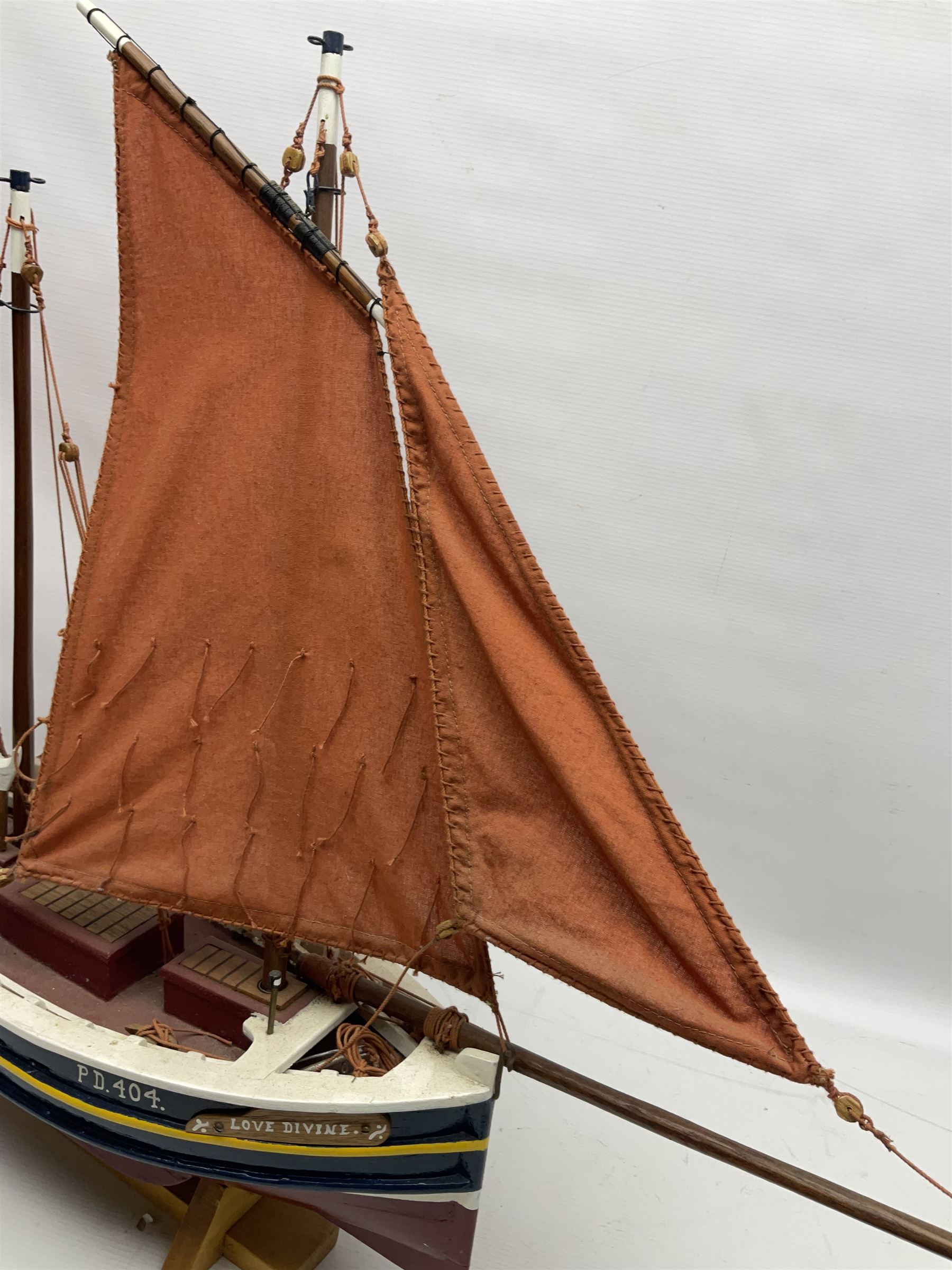 Wooden model of the Peterhead Herring Fishing Boat, Love Divine, PD404. on stand together with Wick Herring Fishing Boat, Galilee WK.1. on stand, L105cm, H64cm