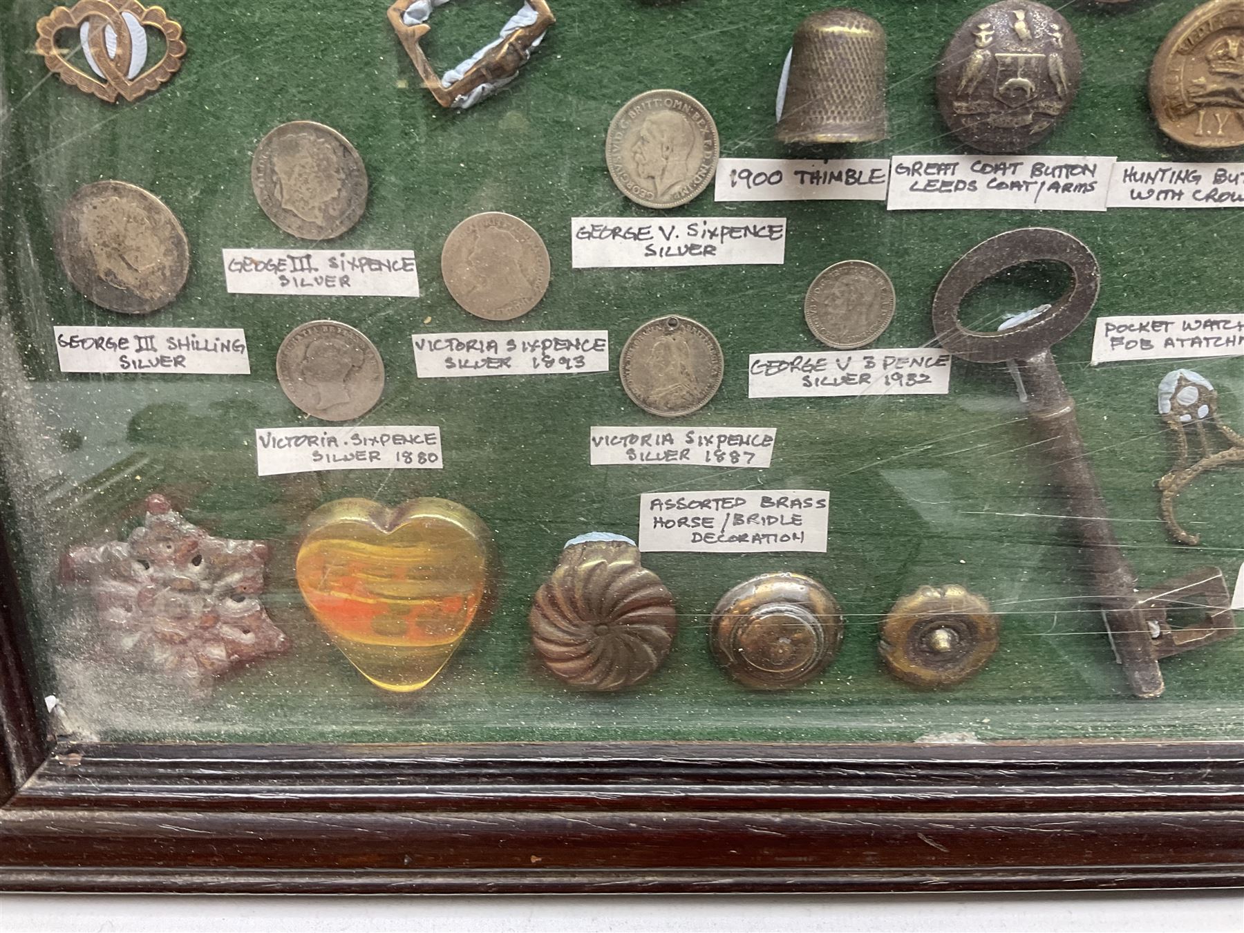Collection of metal detecting finds and antiquities, housed on five display boards and some loose, to include coins, keys, axe head etc 