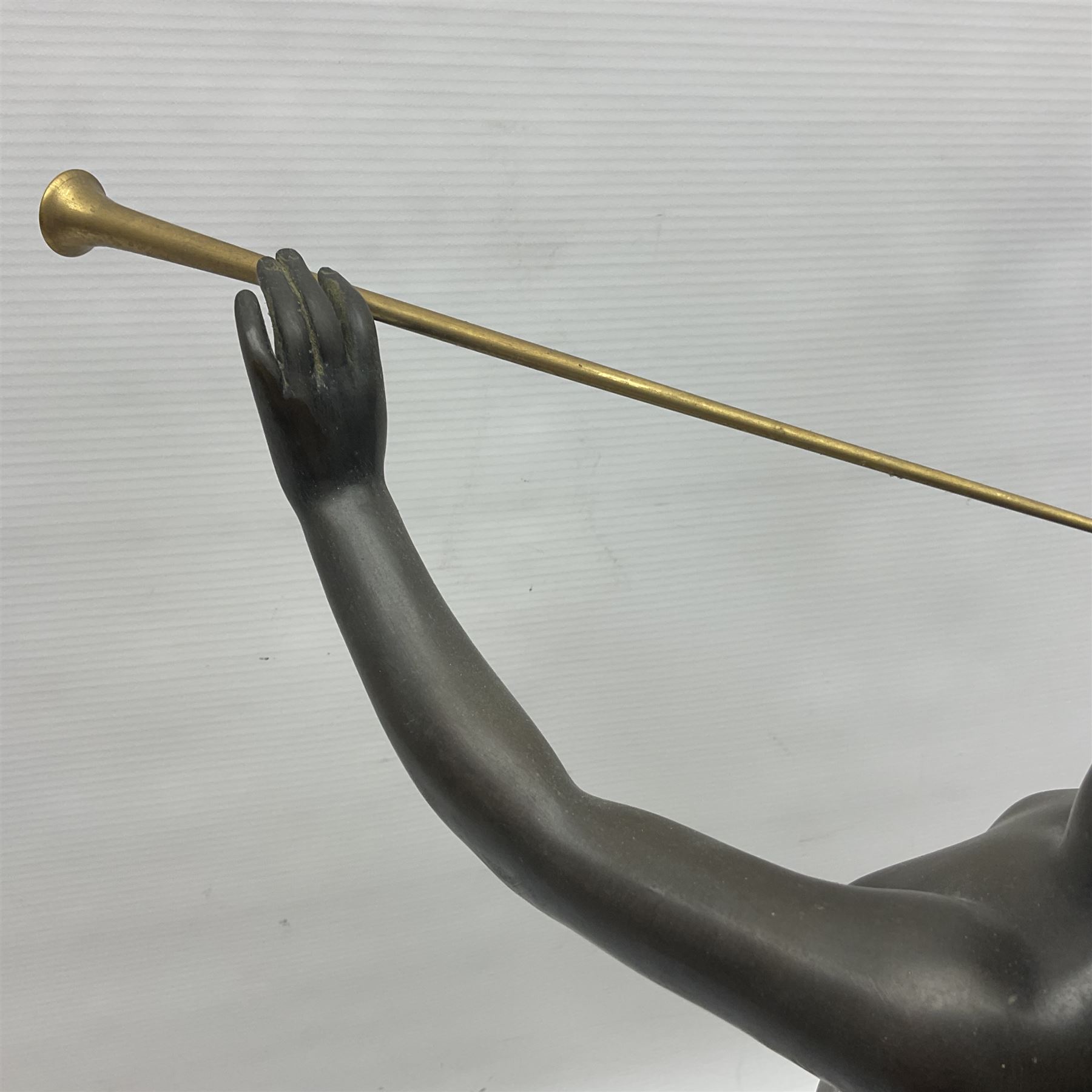 After Eugen Schlipf, Fanfair, bronzed female figure playing two horns, upon a circular marble plinth, H57cm