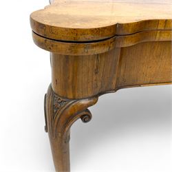 Georgian walnut fold-over card table, shaped rectangular top opening to reveal a baize-lined surface, supported by a concertina pull-out rear mechanism, frieze fitted with single drawer, raised on cabriole supports with foliate carvings terminating in pad feet