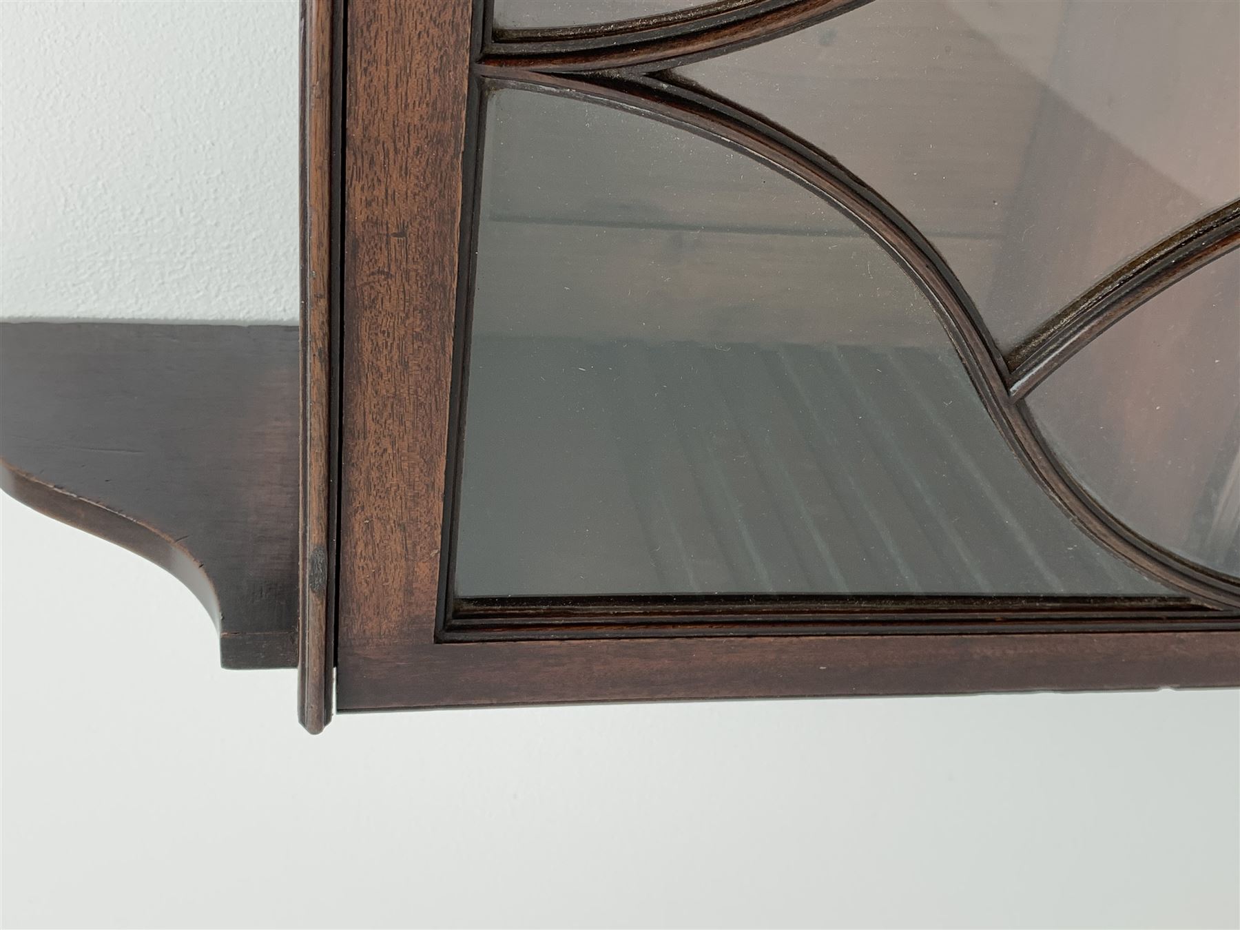 Georgian mahogany Gothic wall hanging cabinet, enclosed by two ogee pointed arch astragal glazed doors, plain sides with shaped top and bottom brackets