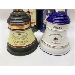 Bells, Scotch whisky, in seven Wade ceramic decanters, comprising two Christmas decanters 1990 and 1991, 60th birthday of Queen Elizabeth II decanter, Golden Wedding anniversary of the Queen and the Duke of Edinburgh decanter, Birth of Princess Beatrice decanter, Birth of Princess Eugenie decanter and Queen's mothers, together with Bells, blended Scotch whiskies, three miniatures in Wade ceramic decanters, various contents and proofs