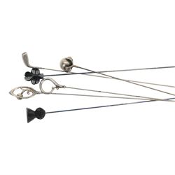 Collection of four silver hatpins including two Charles Horner examples, hallmarked, together with two other hatpins, all within a metal case