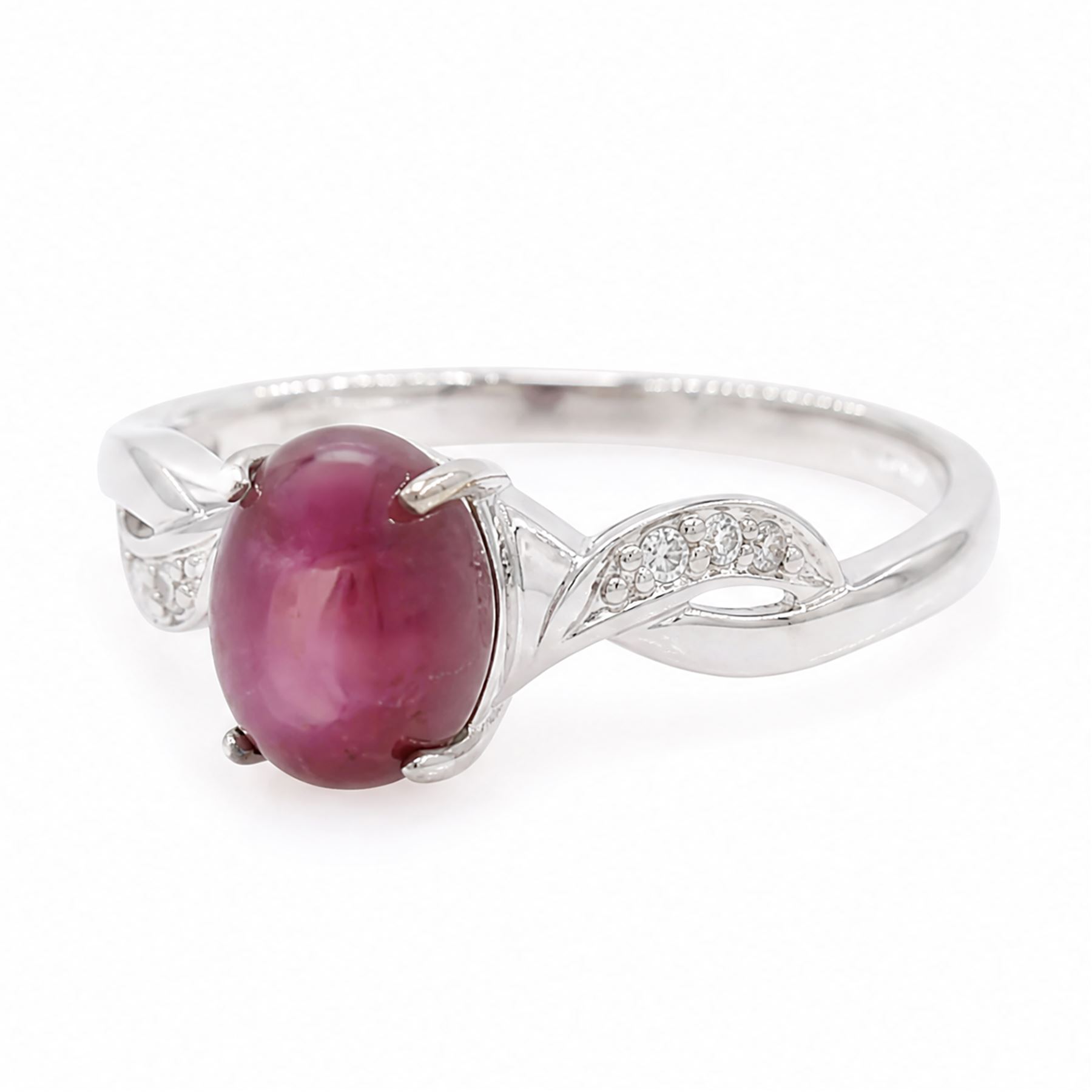 9ct white gold star ruby ring, single cabochon cut ruby, with crossover diamond chip shoulders, hallmarked