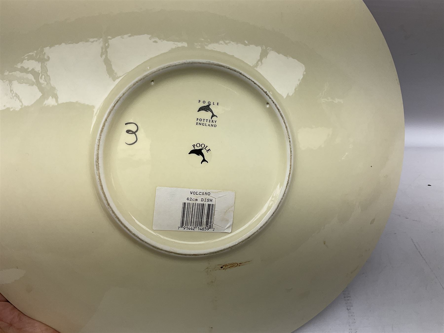 Collection of Poole Pottery, comprising charger and vase in Volcano pattern and a duck figure in a similar pattern 