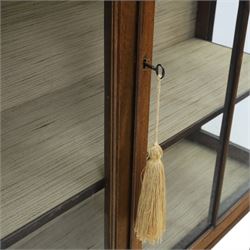 Edwardian mahogany display cabinet, blind-fretwork frieze over astragal glazed doors, square legs with fretwork detail