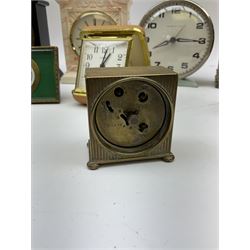 Miniature 'Zenith' travel alarm clock, in engine turned brass case with silvered numerical chapter ring, H5cm, together with other clocks to include Aynsley Portland Ware mantel clock, with moulded peacock design, Europa travelling clock, brass carriage clock, German copper clock of cube form etc