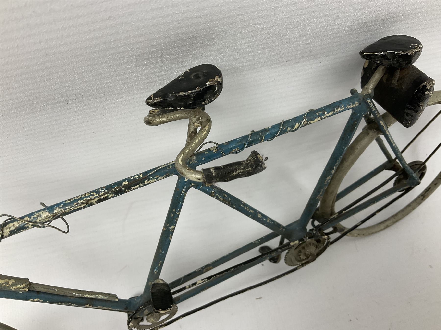 Chad Valley clockwork Fordson Major Tractor, a group of play worn Britains and other lead and metal farm animals, figures and accessories including a kennel, haystacks, dovecote, cows, sheep etc, together with a diecast model of a Tandem Bike L31cm