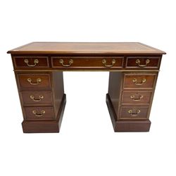 Georgian design mahogany twin pedestal desk, rectangular top with leather writing inset, fitted with nine drawers