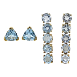 Pair of gold five stone blue topaz pendant earrings and a pair of gold trillion cut blue topaz stud earrings, both hallmarked 9ct